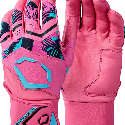 A pair of pink motocross gloves shown from both the back and palm sides. The back of the hand features a black, pink, and turquoise geometric palm pattern, while the back of the wrist has a turquoise and black hexagonal logo with the text 'EVOSHIELD'.