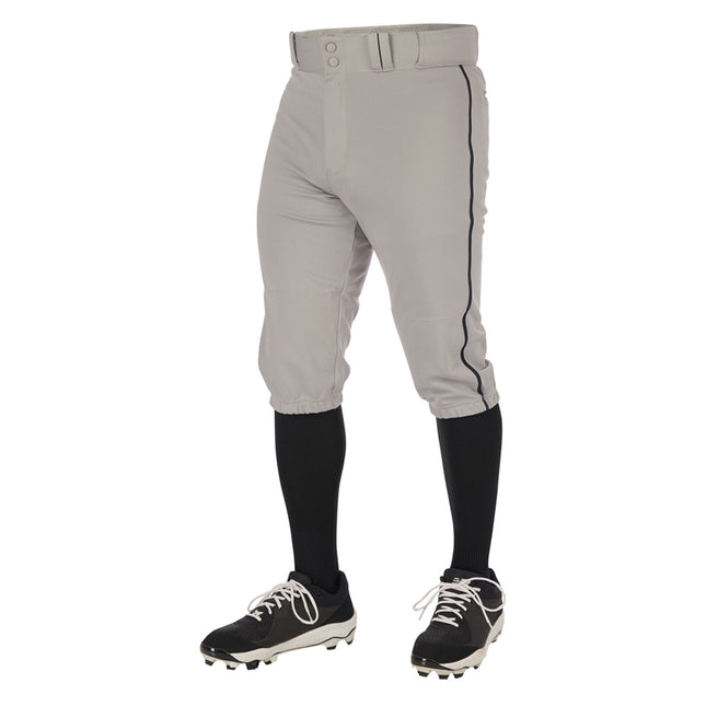 Gray baseball pants with black socks and cleats on a white background
