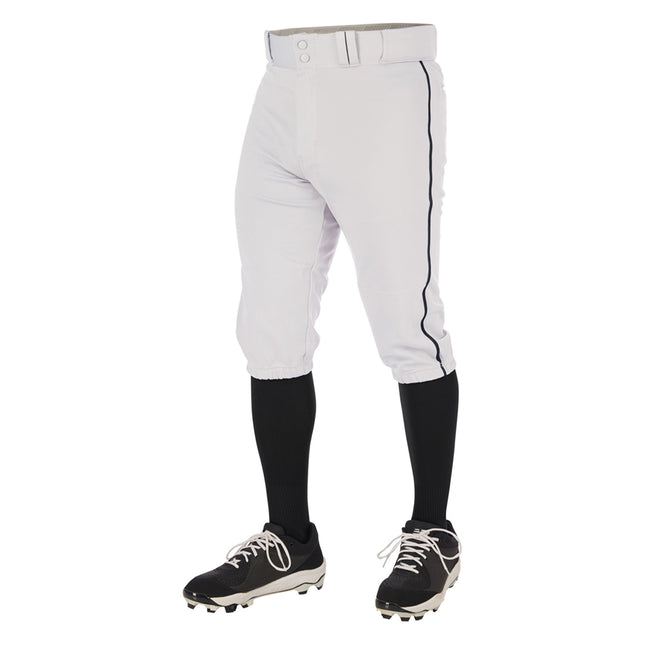 White baseball pants with black socks and cleats on a white background
