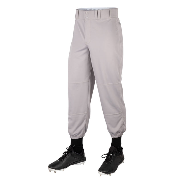 Gray baseball pants worn with black cleats on a white background