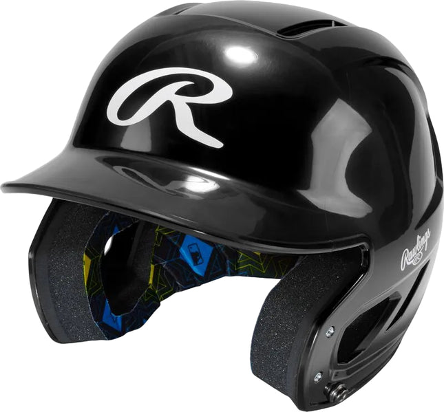 A glossy black baseball batting helmet with a white stylized 'R' logo on the front and a patterned blue, yellow, and black interior liner, shown on a light gray background.