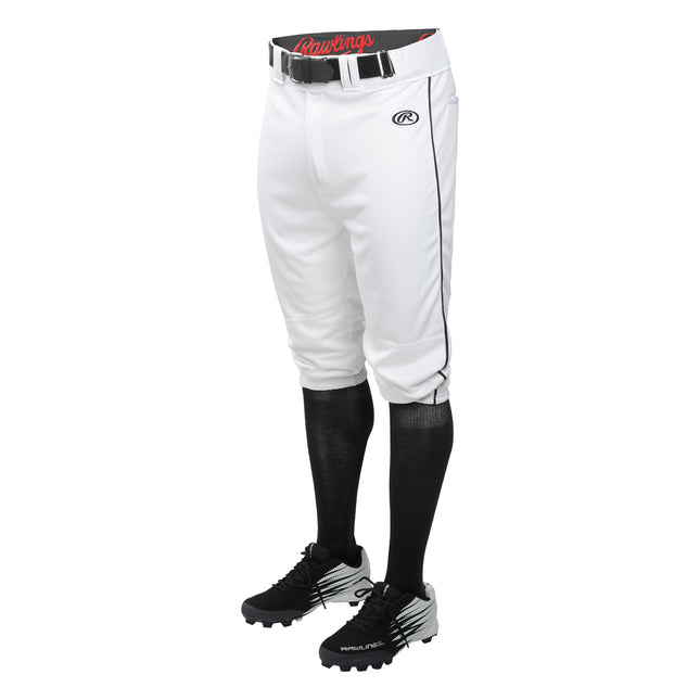 White baseball pants with black socks and shoes on a white background