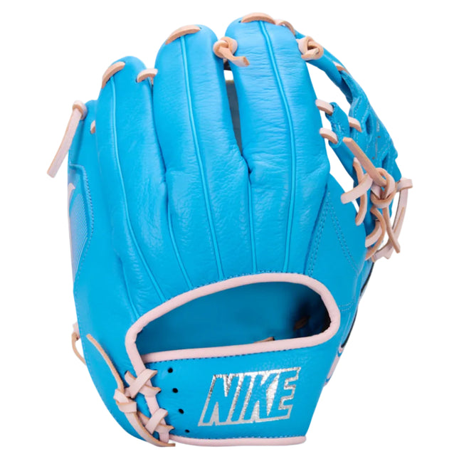 A Nike baseball glove in bright blue with light pink laces and trim, shown against a light gray background.